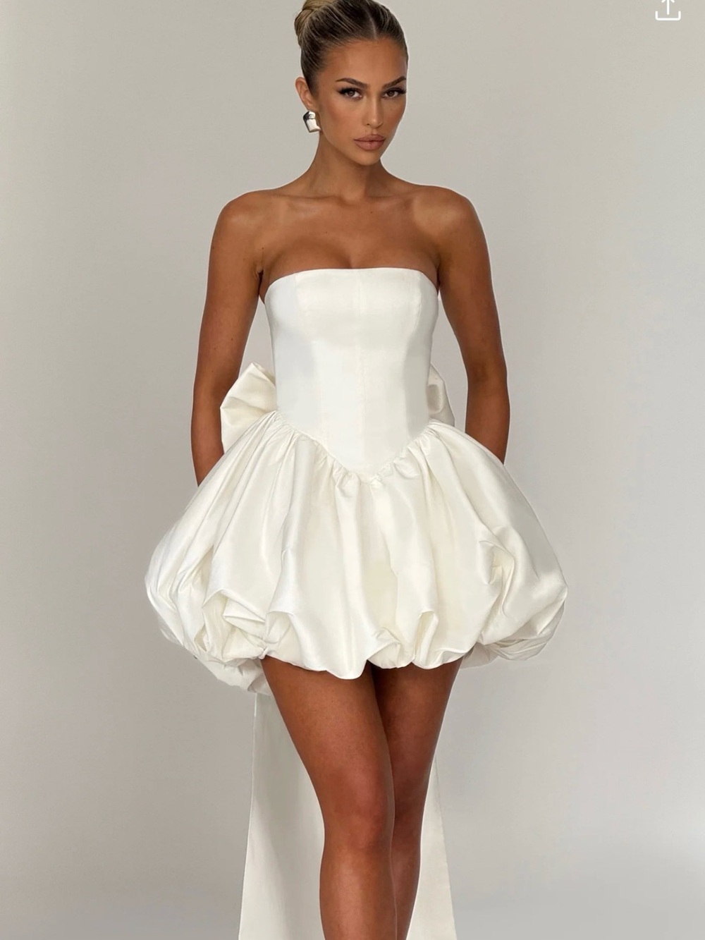 Strapless White Bubble-Hem Mini Dress with Bow Detail
